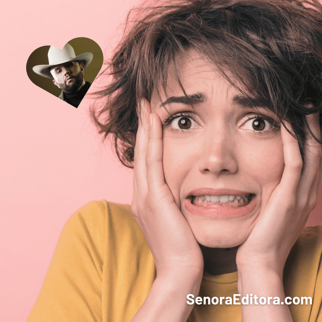 Una mujer de pelo corto toma su cara con sus dos manos y tiene una expresión de angustia. A un lado suyo hay una foto del cantautor de música regional mexicana Carin León en forma de corazón.